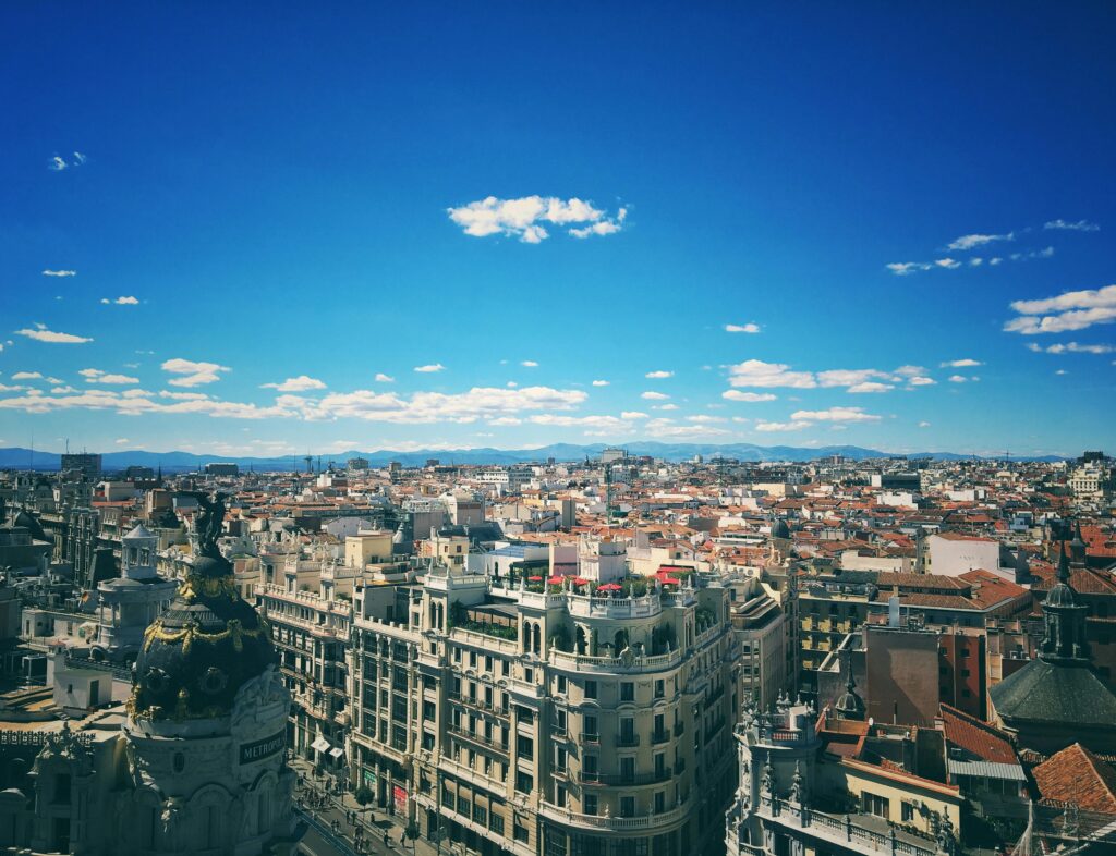 pexels-photo-670261-670261 A breathtaking aerial view of Madrid's vibrant cityscape under a clear blue sky.